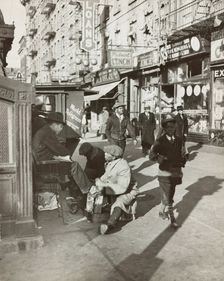View of Lenox Avenue, Harlem, at 135th Street, showing businesses, pedestrians and..., 1939. Creator: Unknown
