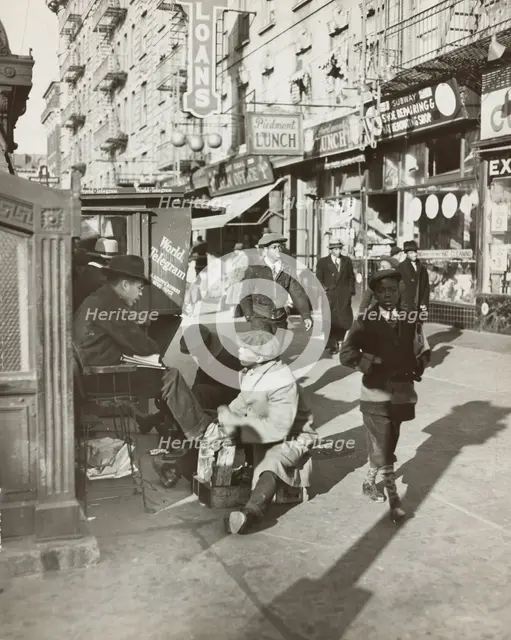 View of Lenox Avenue, Harlem, at 135th Street, showing businesses, pedestrians and..., 1939. Creator: Unknown.