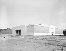 View of nearly completed factory for garment workers, Hightstown, New Jersey, 1936. Creator: Dorothea Lange