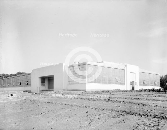 View of nearly completed factory for garment workers, Hightstown, New Jersey, 1936. Creator: Dorothea Lange.