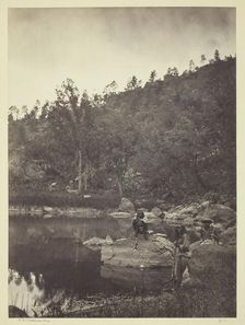 View on Apache Lake, Sierra Blanca Range, Arizona, Two Apache Scouts in the Foreground, 1873. Creator: Tim O'Sullivan