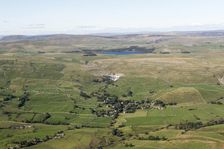 View over the village of Malham towards Malham Cove and Malham Tarn, North Yorkshire, 2019. Creator: Historic England