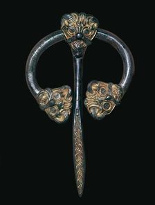 Viking gilded bronze dress fastener, 9th century
