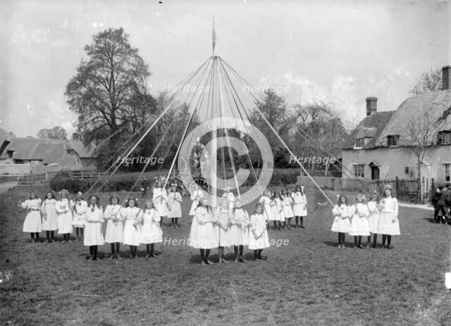 Village children taking part in the maypole dance at East Hanney, Oxfordshire, c1860-c1922. Artist: Henry Taunt