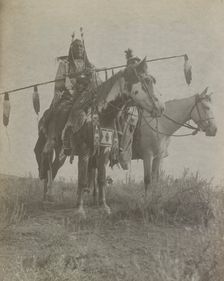 Village criers on horseback, Bird On the Ground and Forked Iron, Crow Indians, Montana, c1908. Creator: Edward Sheriff Curtis