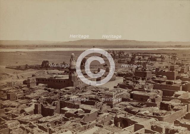 Village of Edfu, View Taken from the Pylon of the Temple, late 19th century. Creator: Henri Bechard.