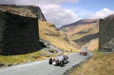Vintage cars climbing Honister Pass, Lake District, Cumbria. Creator: Peter Thompson