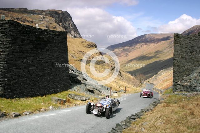 Vintage cars climbing Honister Pass, Lake District, Cumbria.   Creator: Peter Thompson.