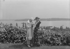 Viola Kraus and Helen Freeman standing outdoors, 1915 June. Creator: Arnold Genthe