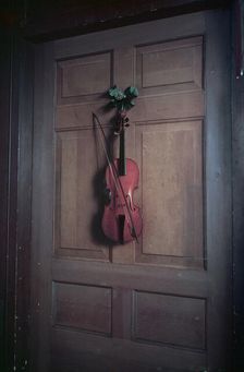 Violin on a door painted by Jan van der Vaart, Chatsworth House, Derbyshire, c1955. Creator: Arthur Charles Kirby Ware