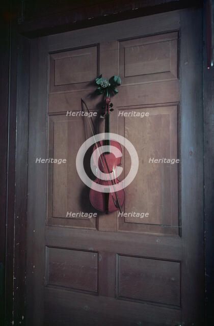 Violin on a door painted by Jan van der Vaart, Chatsworth House, Derbyshire, c1955. Creator: Arthur Charles Kirby Ware.