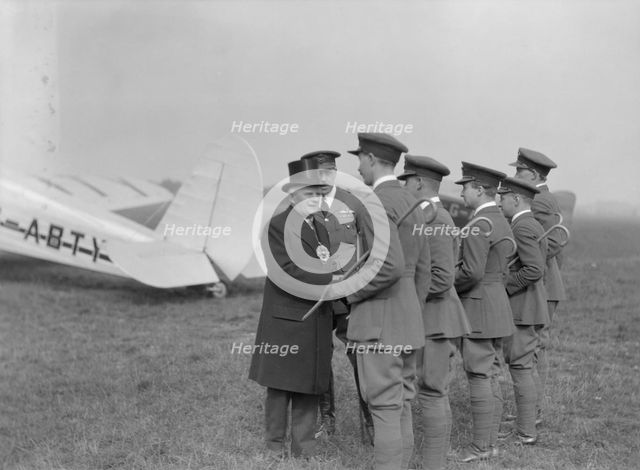 Visiting dignitary meeting airmen at Heston Aerodrome, Hounslow, London, c1933-c1935. Creator: Aerofilms.