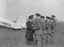 Visiting dignitary meeting airmen at Heston Aerodrome, Hounslow, London, c1933-c1935. Creator: Aerofilms
