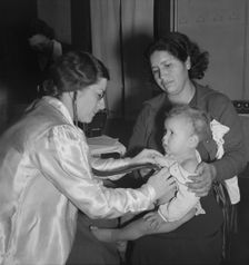 Visiting public health doctor conducts well-baby clinic..., Calipatria, Imperial Valley, 1939. Creator: Dorothea Lange
