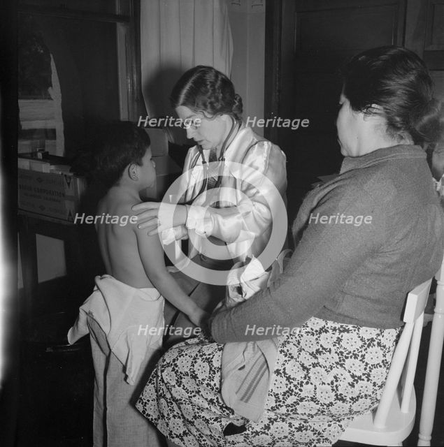 Visiting public health doctor conducts well-baby clinic..., Calipatria, Imperial Valley, 1939. Creator: Dorothea Lange.