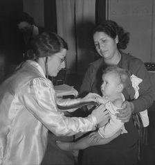Visiting public health doctor conducts well-baby clinic..., Calipatria, Imperial Valley, 1939. Creator: Dorothea Lange