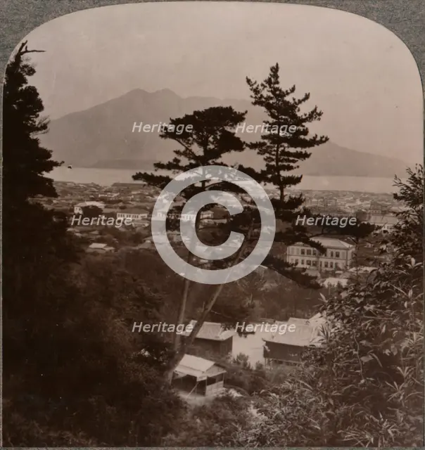 'Vista from hills above Kagoshima over Lake to distant Sakurajima volcano, Japan', 1904. Artist: Unknown.