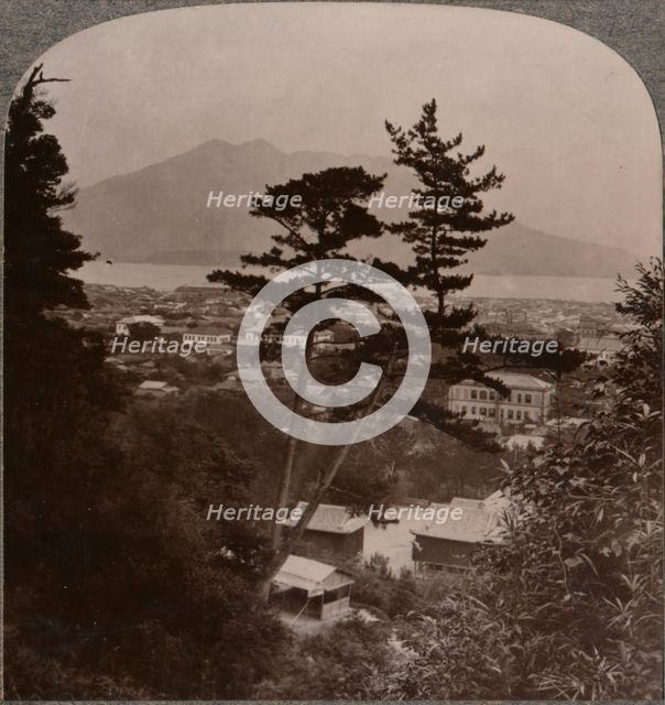 'Vista from hills above Kagoshima over Lake to distant Sakurajima volcano, Japan', 1904. Artist: Unknown.