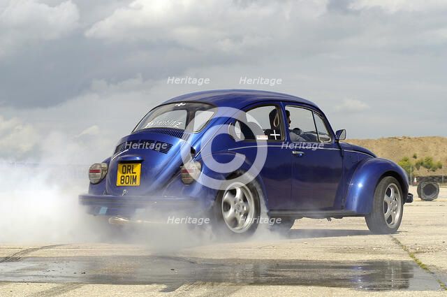 VW Beetle Burning out. Artist: Unknown.