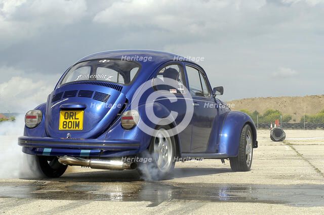 VW Beetle Burning out. Artist: Unknown.