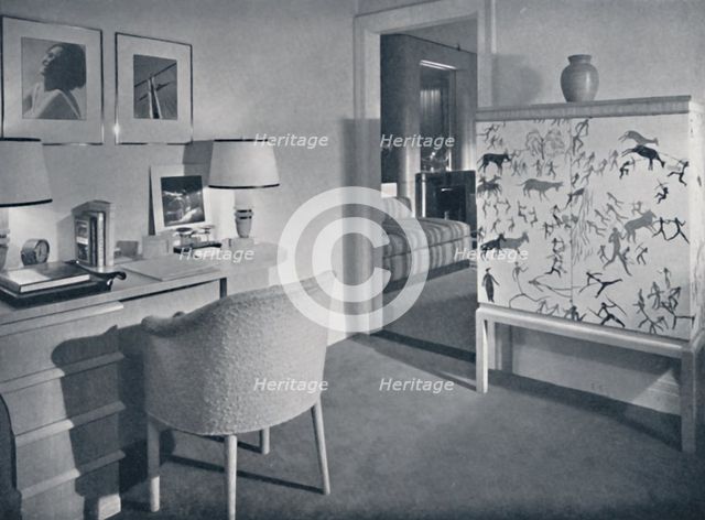 'W. & J. Sloane. Photographer's hobby room showing a desk in natural oak, a hand-woven covering on t Artist: Unknown.