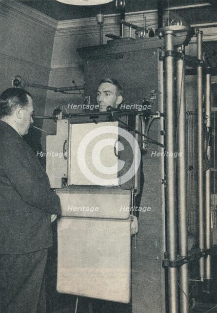 X-ray apparatus used for examination of suspected cases of heart or lung disease, c1935 (c1937). Artist: Unknown.