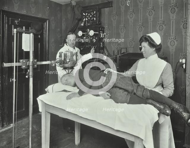 X-ray room for ring worm, Woolwich School Treatment Centre, London, 1914. Artist: Unknown.