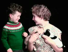 Young boy and woman holding two puppies, c1955-1965. Creator: Arthur Charles Kirby Ware