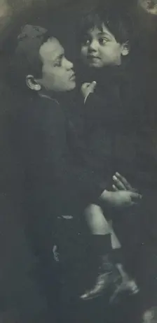 Young boy holding a smaller child, c1900. Creator: Elizabeth B. Brownell