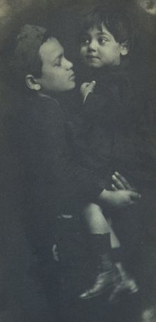 Young boy holding a smaller child, c1900. Creator: Elizabeth B. Brownell