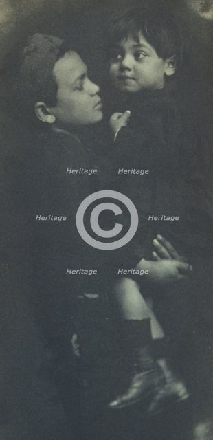 Young boy holding a smaller child, c1900. Creator: Elizabeth B. Brownell.