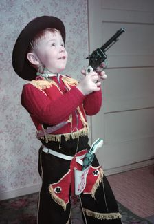 Young boy in a cowboy outfit, c1955. Creator: Arthur Charles Kirby Ware