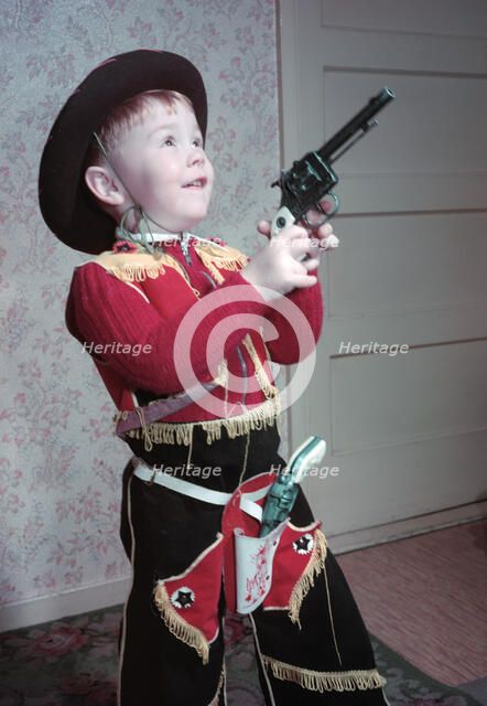 Young boy in a cowboy outfit, c1955.  Creator: Arthur Charles Kirby Ware.