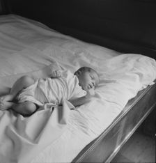 Young baby born on the Delta cooperative farm, Hillhouse, Mississippi, 1937. Creator: Dorothea Lange