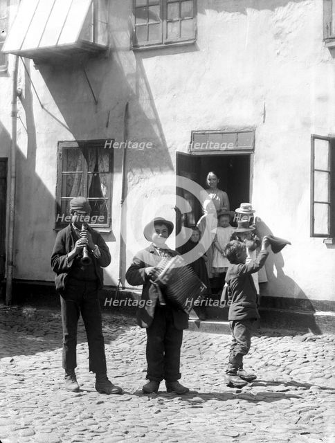 Young backyard musicians, Landskrona, Sweden 1910. Creator: Unknown.