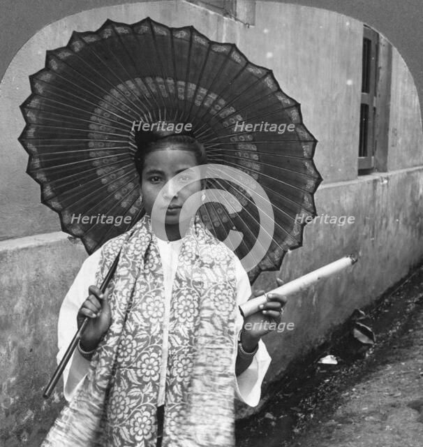 Young Burmese woman holding a huge cigar, Rangoon, Burma, 1908. Artist: Stereo Travel Co