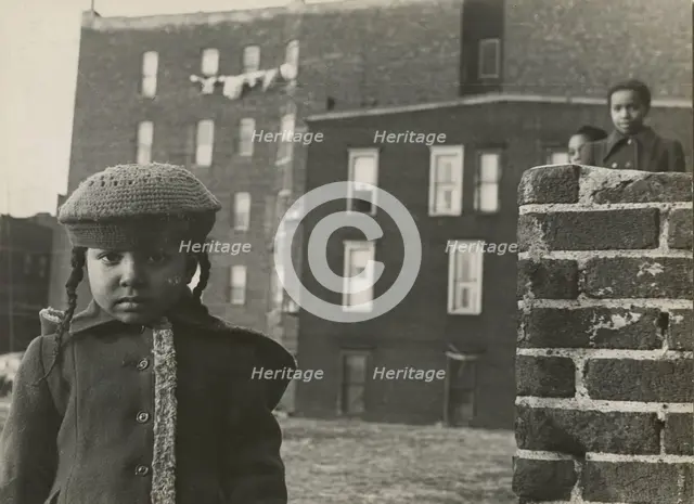 Young girl, with other children in background, in a vacant lot behind some tenement..., 1947 - 1951. Creator: Romulo Lachatanere.