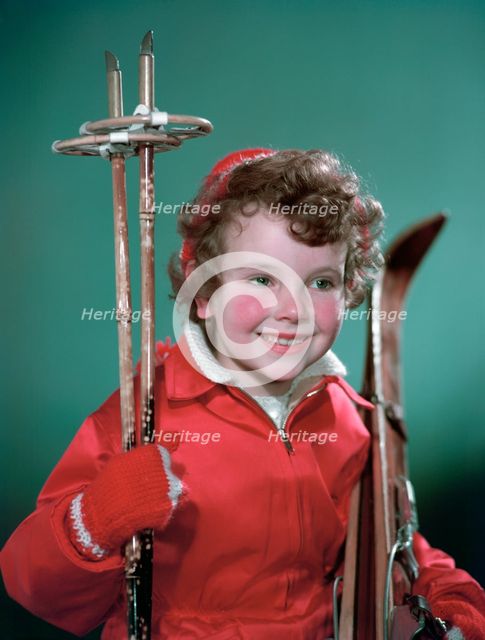 Young girl with cross-country ski equipment, c1955.  Creator: Arthur Charles Kirby Ware.
