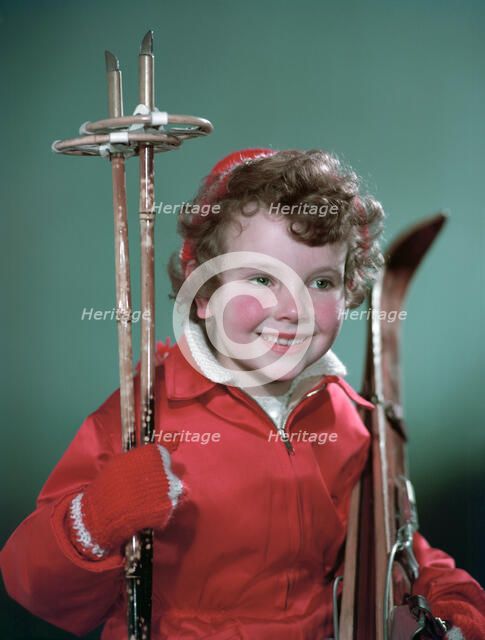 Young girl with cross-country ski equipment, c1955.  Creator: Arthur Charles Kirby Ware.