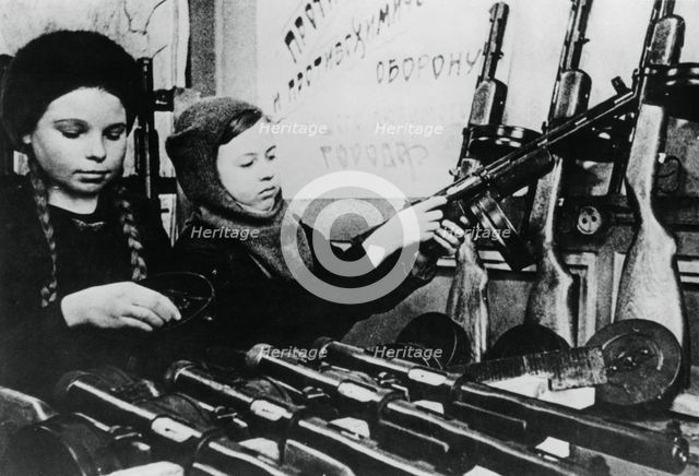 Young girls assembling machine guns in a Russian factory, 1943. Artist: Unknown