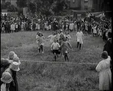 Young Girls Finishing a Running Race in a Field, 1920. Creator: British Pathe Ltd
