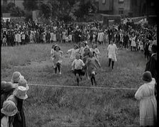 Young Girls Finishing a Running Race in a Field, 1920. Creator: British Pathe Ltd