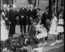Young Girls Leaving Flowers in a Pile for Wilhelmina, Her Majesty the Queen of the Netherlands,1930s Creator: British Pathe Ltd