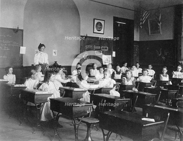 Young girls seated at desks in Washington, D.C. classroom, (1899?). Creator: Frances Benjamin Johnston.