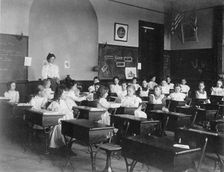 Young girls seated at desks in Washington, D.C. classroom, (1899?). Creator: Frances Benjamin Johnston