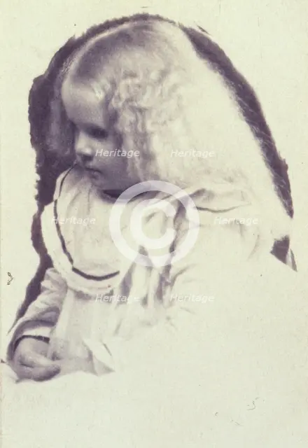 Young fair haired girl seated with hands in her lap, c1900. Creator: Estelle Huntington Huggins.