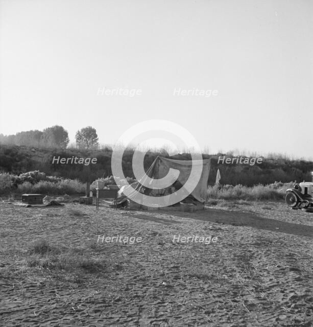 Young family on ditch bank, waiting to enter... camp (FSA), Merrill, Klamath County, Oregon, 1939. Creator: Dorothea Lange.