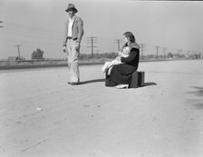 Young family, penniless, hitchhiking on U.S. Highway 99, California, 1936. Creator: Dorothea Lange