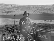 Young farmer, member of Ola self-help sawmill co-op, plowing..., Gem County, Idaho, 1939. Creator: Dorothea Lange