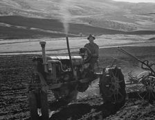 Young farmer, member of Ola self-help sawmill co-op, plowing..., Gem County, Idaho, 1939. Creator: Dorothea Lange